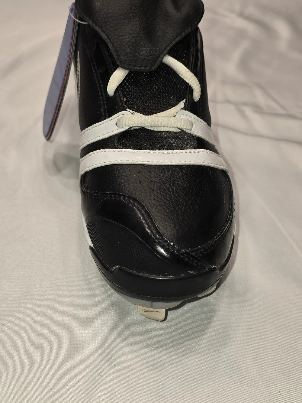 Nike Black and White Baseball Cleats with Colored Heel Tabs